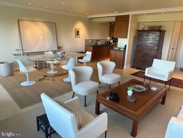 a living room with furniture and a mirror