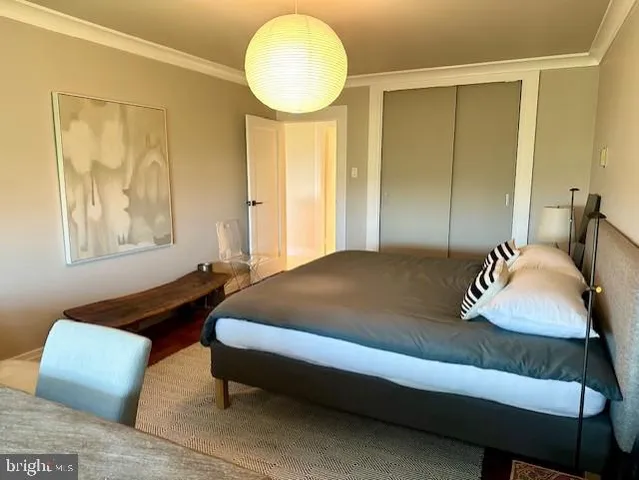 a bedroom with bed and window