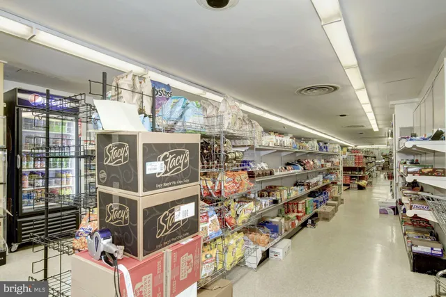 a view of a food market with retail stalls