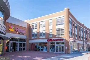 a view of an empty room with a book shelf