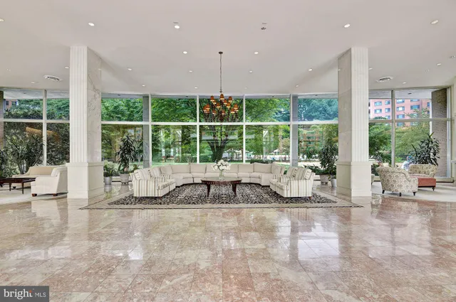 a room with pool table and sofas