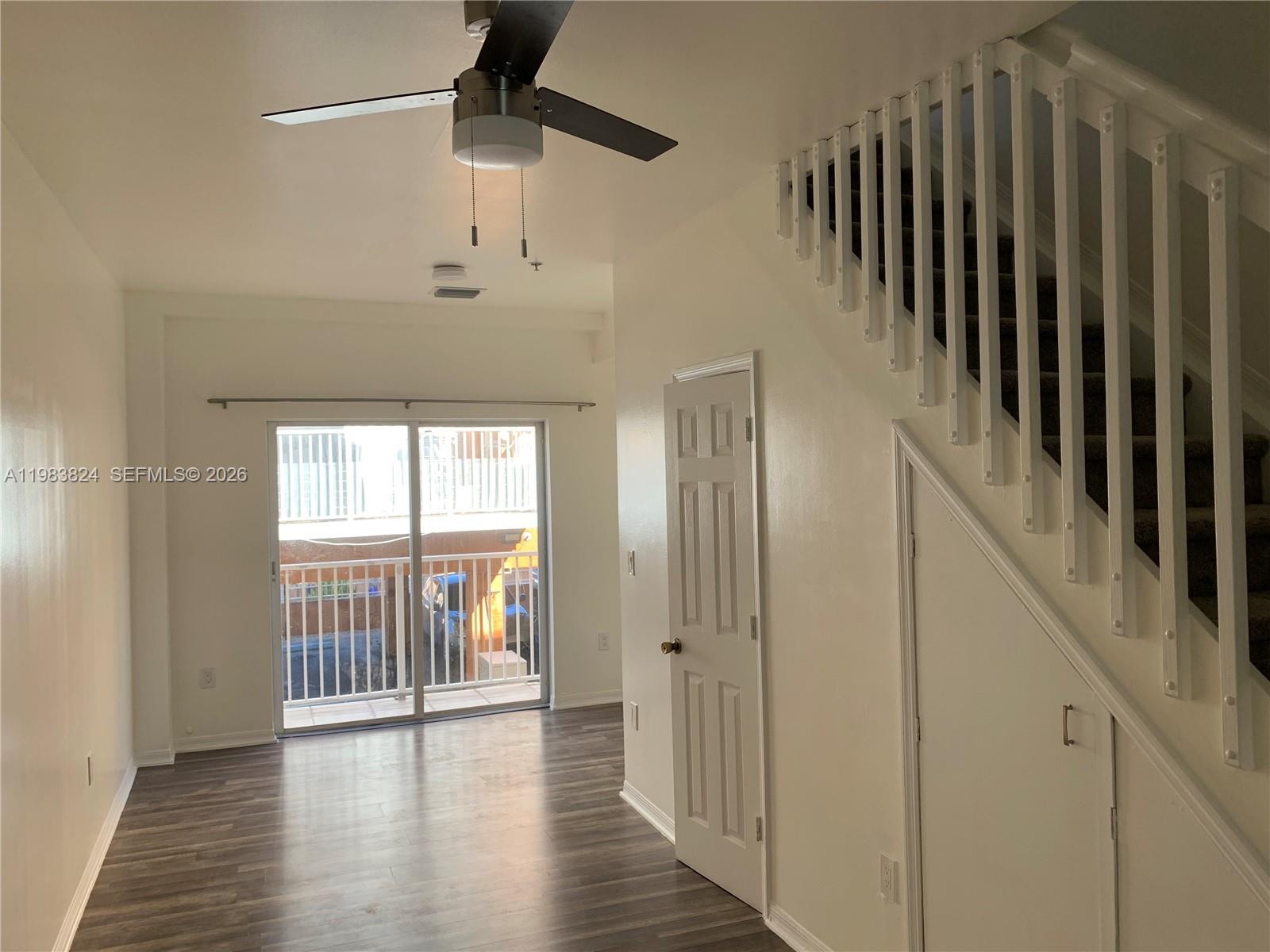 928 Southwest 3rd Street, Unit 203 Miami, FL 33130 - Photo 3 of 11 a view of hallway with wooden floor and stairs