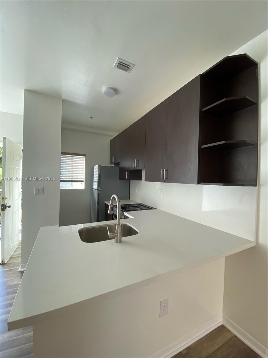 928 Southwest 3rd Street, Unit 203 Miami, FL 33130 - Photo 4 of 11 a close view of sink