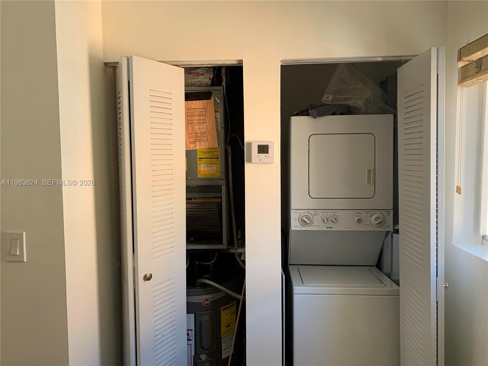 928 Southwest 3rd Street, Unit 203 Miami, FL 33130 - Photo 8 of 11 a utility room with dryer and washer