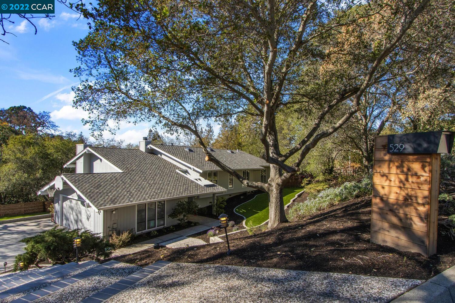 a view of a house with a yard