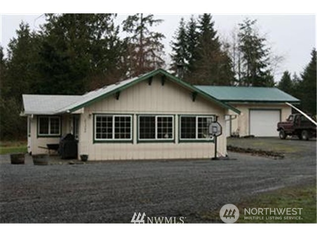 19027 214th Street East Orting, WA 98360 - Photo 1 of 1 a front view of a house with a garden
