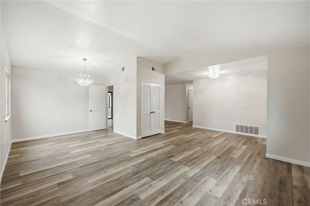 13240 Olive Tree Lane Poway, CA 92064 - Photo 12 of 50 a view of an empty room with wooden floor