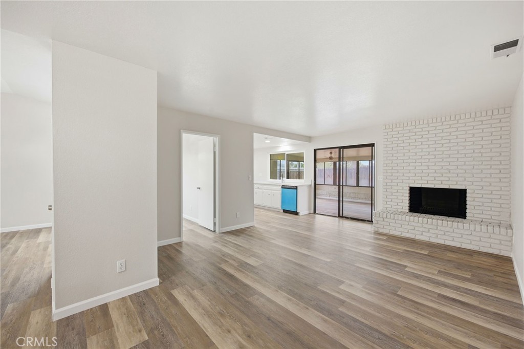 13240 Olive Tree Lane Poway, CA 92064 - Photo 15 of 50 a view of an empty room with window and wooden floor