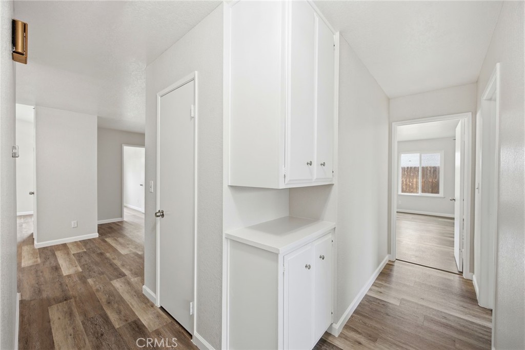 13240 Olive Tree Lane Poway, CA 92064 - Photo 22 of 50 a view of hallway with wooden floor