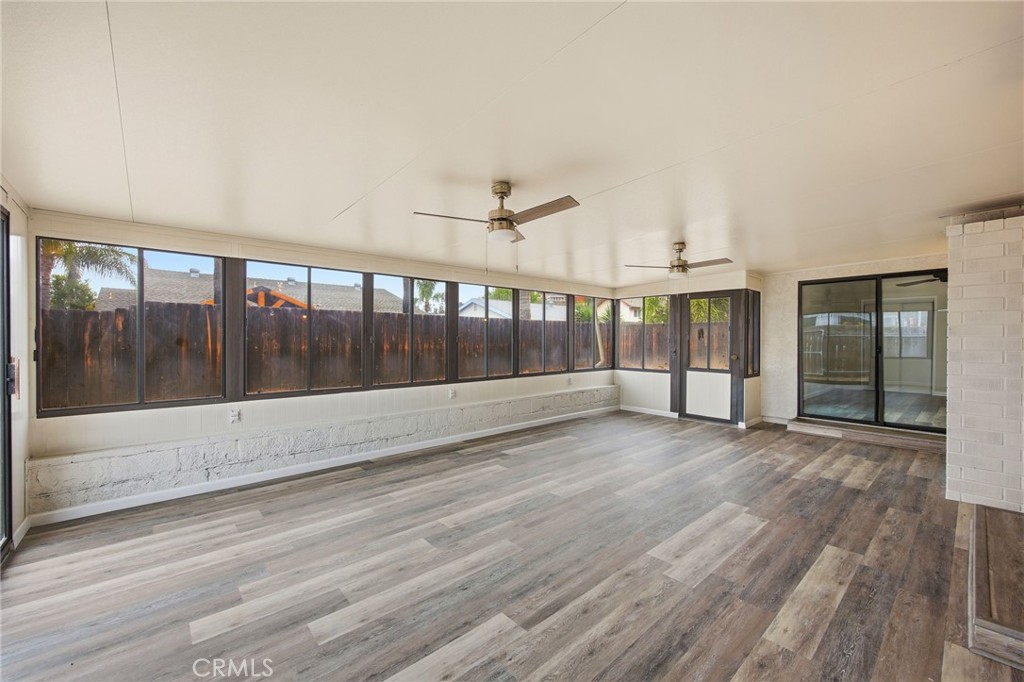 13240 Olive Tree Lane Poway, CA 92064 - Photo 23 of 50 a view of an empty room with wooden floor and a window
