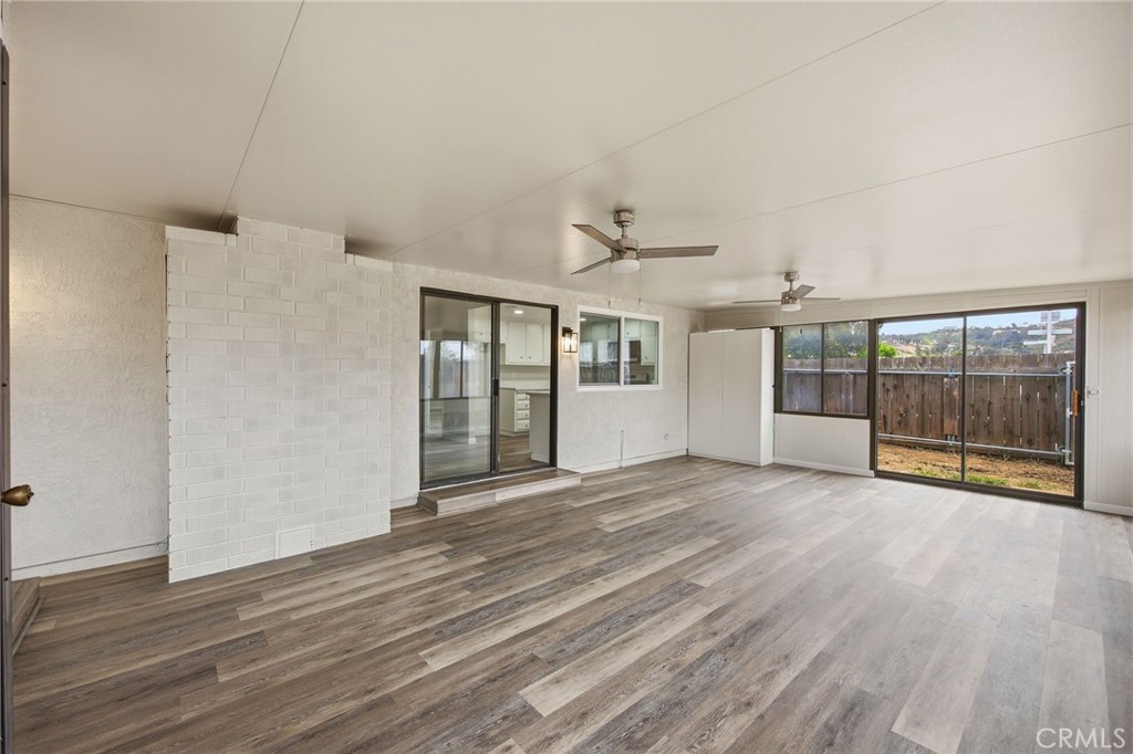 13240 Olive Tree Lane Poway, CA 92064 - Photo 25 of 50 a view of an empty room with wooden floor and a window