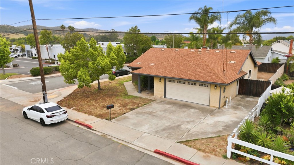 13240 Olive Tree Lane Poway, CA 92064 - Photo 45 of 50 a view of a patio with a table chairs and a potted plants