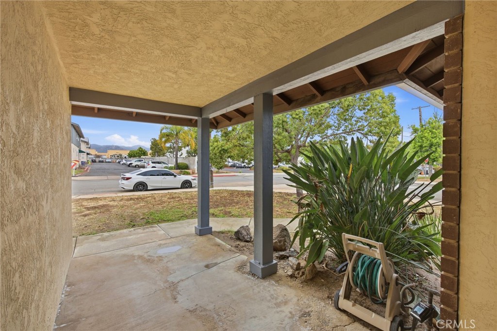 13240 Olive Tree Lane Poway, CA 92064 - Photo 7 of 50 a view of a porch with furniture and a yard