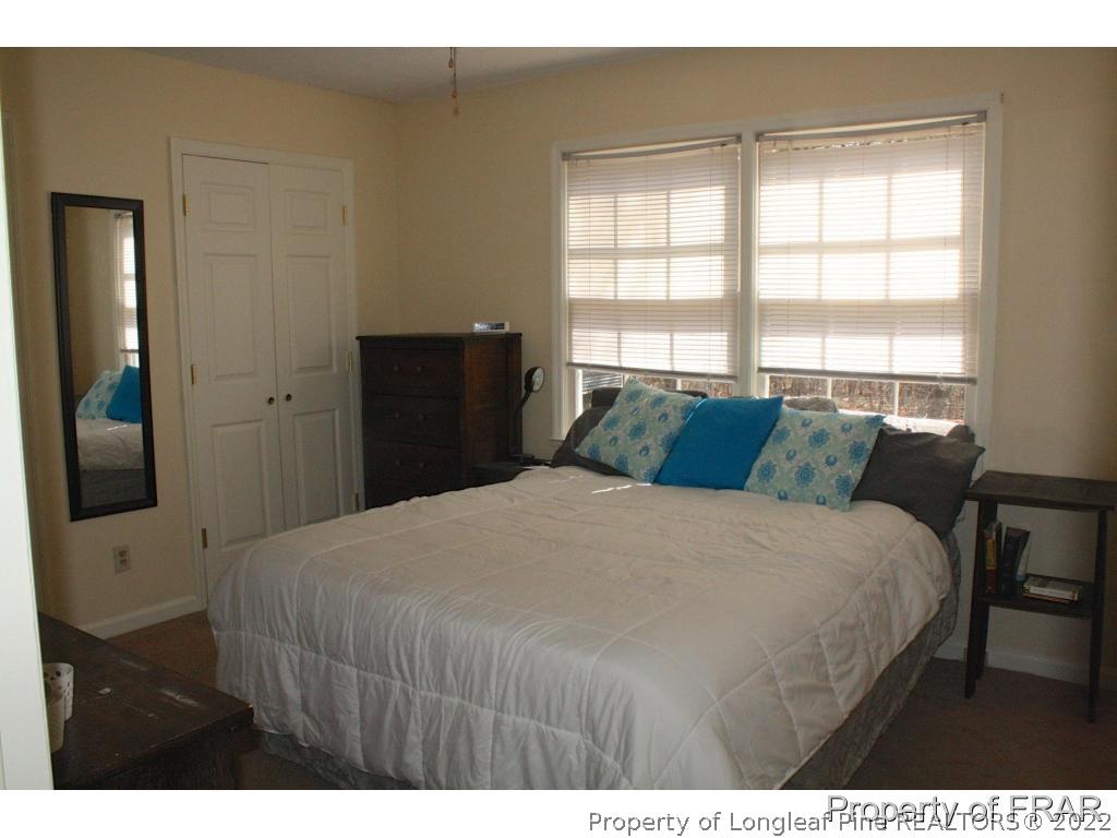 3318 Arrowhead Road Spring Lake, NC 28390 - Photo 9 of 21 a bedroom with a bed and a large window