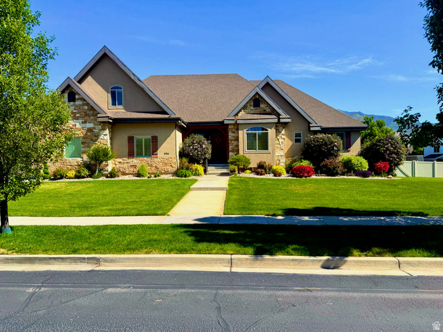 Siding combination of stucco and stone veneer