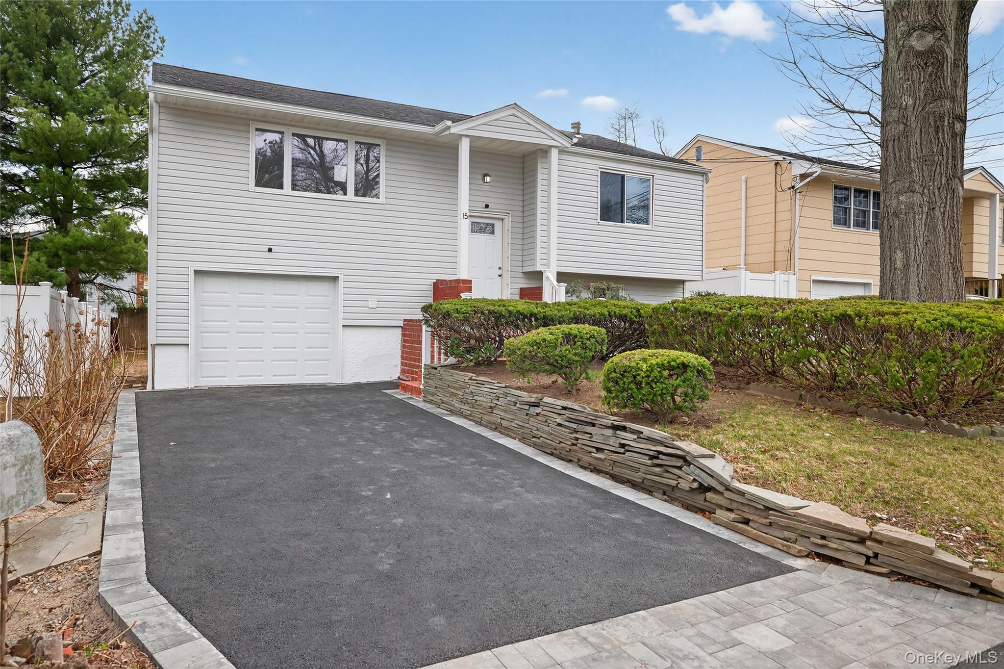 15 Lindsay Street Huntington, NY 11743 - Photo 2 of 23 a front view of a house with garden