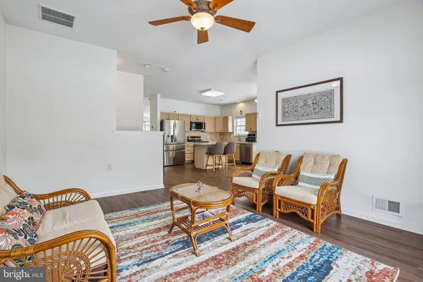 a living room with furniture and a rug