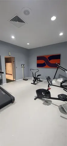 a living room with furniture a rug and a fireplace