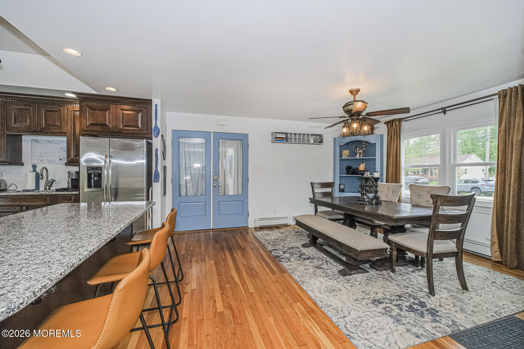 5 Riccis Drive Jackson, NJ 08527 - Photo 11 of 32 a living room with stainless steel appliances granite countertop a table chairs and a wooden floor