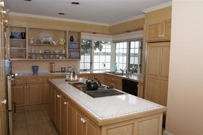 269 Seapuit Road Osterville, MA 02655 - Photo 8 of 12 a kitchen with a stove and a refrigerator