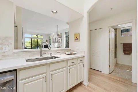 a kitchen with a sink and cabinets