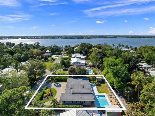 an aerial view of house with a swimming pool