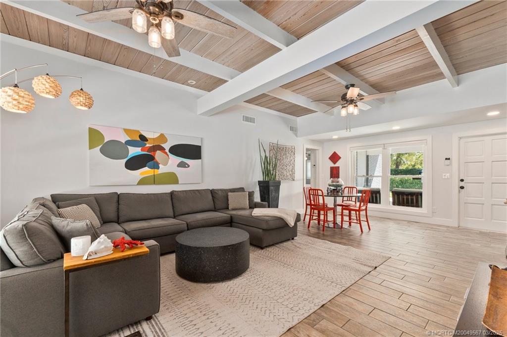 530 South Manor Drive Stuart, FL 34994 - Photo 12 of 55 a living room with furniture and wooden floor