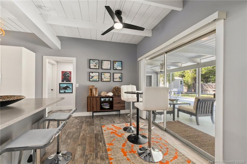 530 South Manor Drive Stuart, FL 34994 - Photo 14 of 55 a living room with furniture and a large window