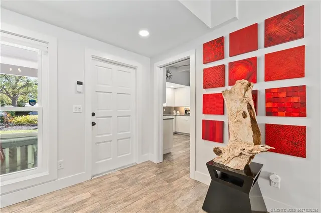 a bedroom with a large bed and a large window