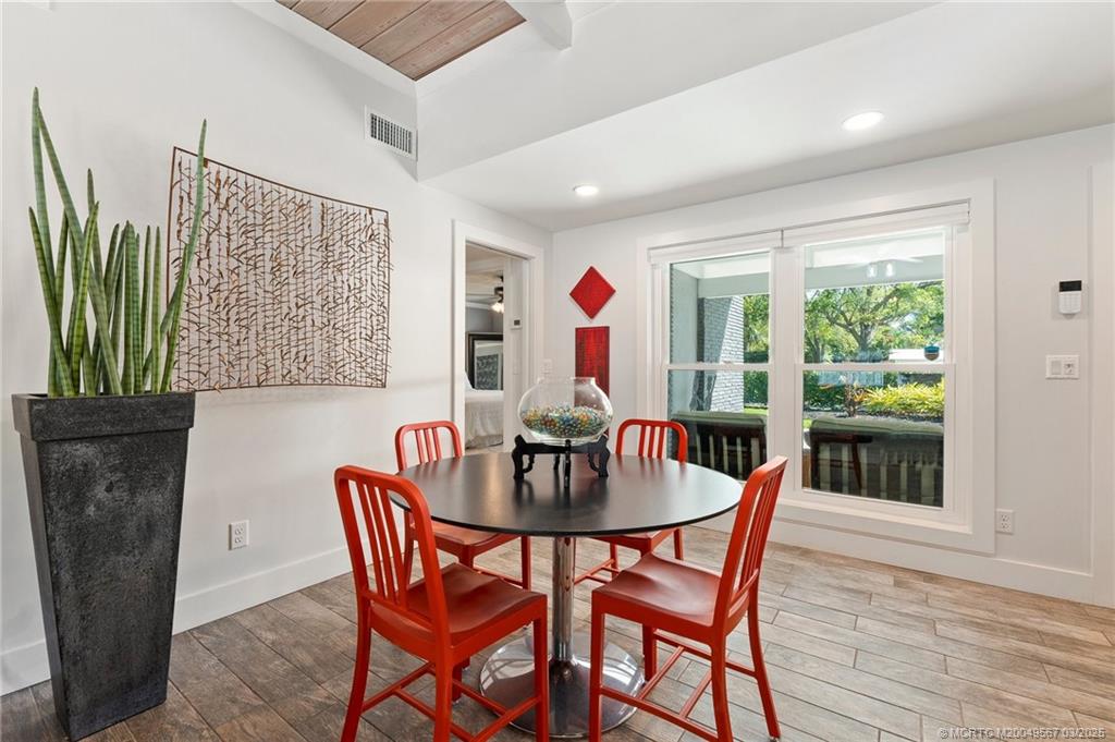 530 South Manor Drive Stuart, FL 34994 - Photo 21 of 55 a dining room with furniture and wooden floor