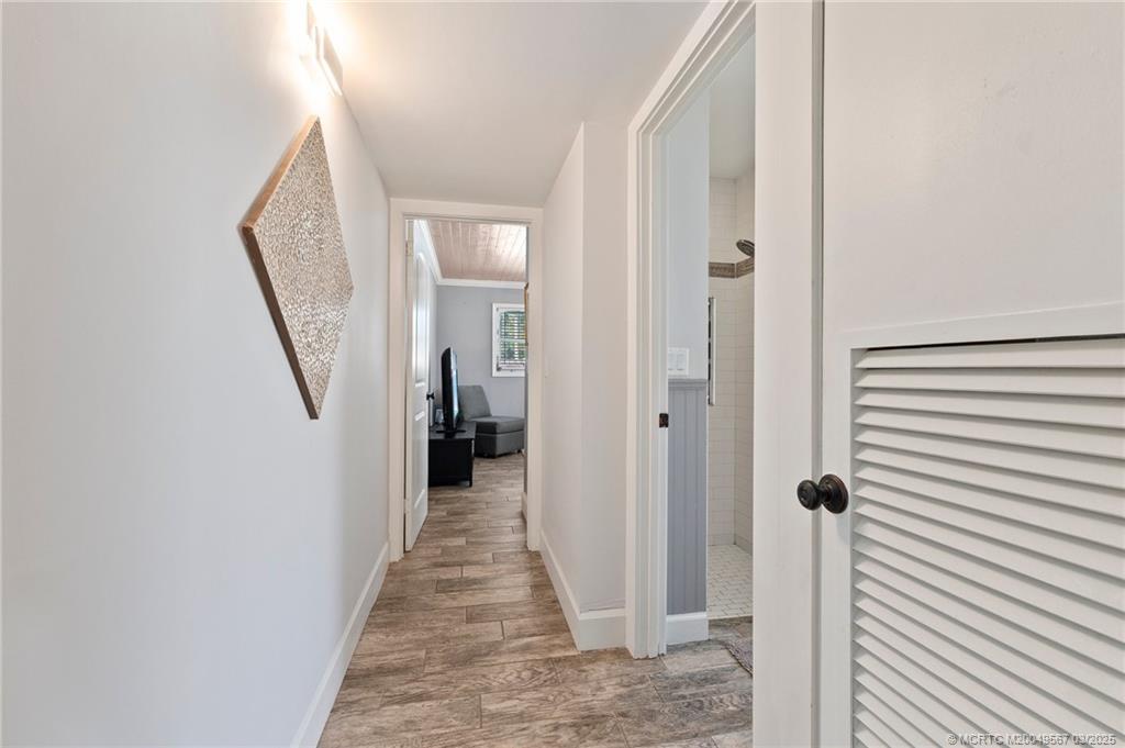530 South Manor Drive Stuart, FL 34994 - Photo 25 of 55 a view of a hallway with a wooden door