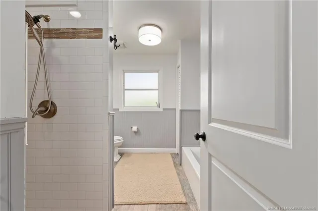a bathroom with a bathtub and shower