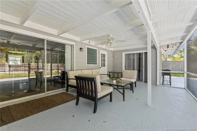 a bed room with a bed and a large window