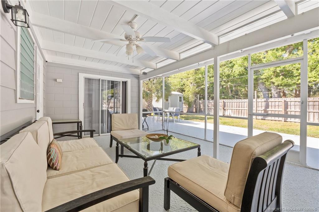 530 South Manor Drive Stuart, FL 34994 - Photo 37 of 55 a living room with furniture and a large window