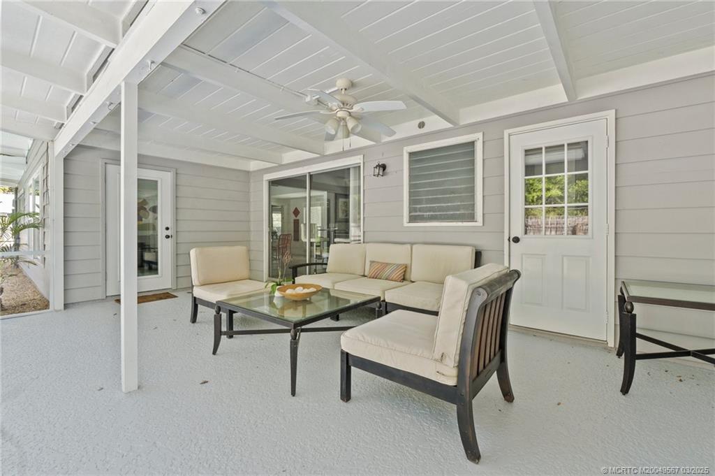 530 South Manor Drive Stuart, FL 34994 - Photo 38 of 55 a living room with furniture and a window