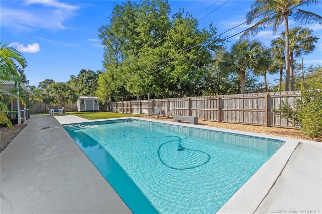 530 South Manor Drive Stuart, FL 34994 - Photo 44 of 55 swimming pool view with a garden space