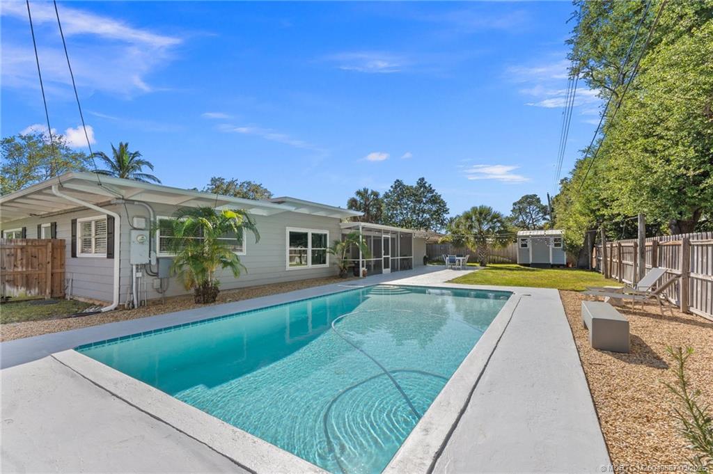 530 South Manor Drive Stuart, FL 34994 - Photo 45 of 55 a view of house with swimming pool outdoor seating