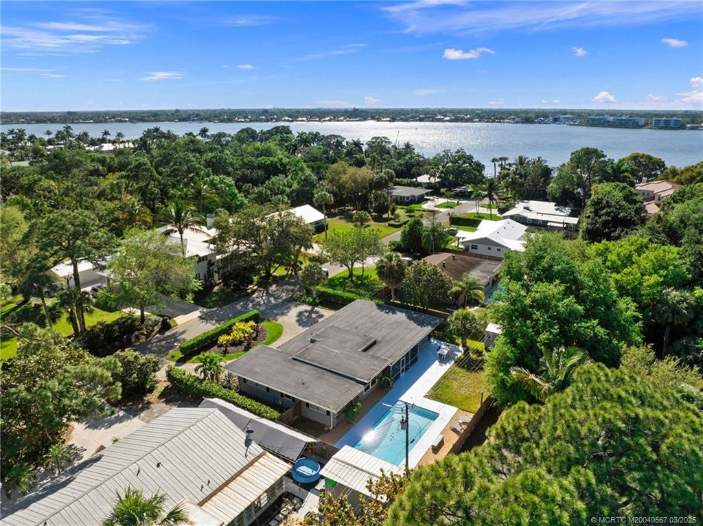 530 South Manor Drive Stuart, FL 34994 - Photo 53 of 55 an aerial view of a building with outdoor space and lake view