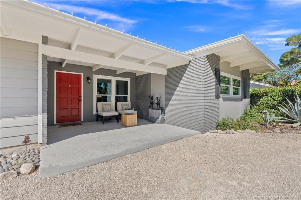 530 South Manor Drive Stuart, FL 34994 - Photo 7 of 55 a view of a house with porch and seating space