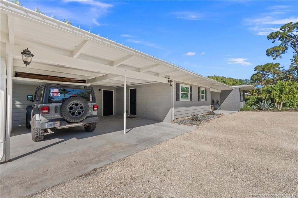 530 South Manor Drive Stuart, FL 34994 - Photo 8 of 55 a view of a car garage