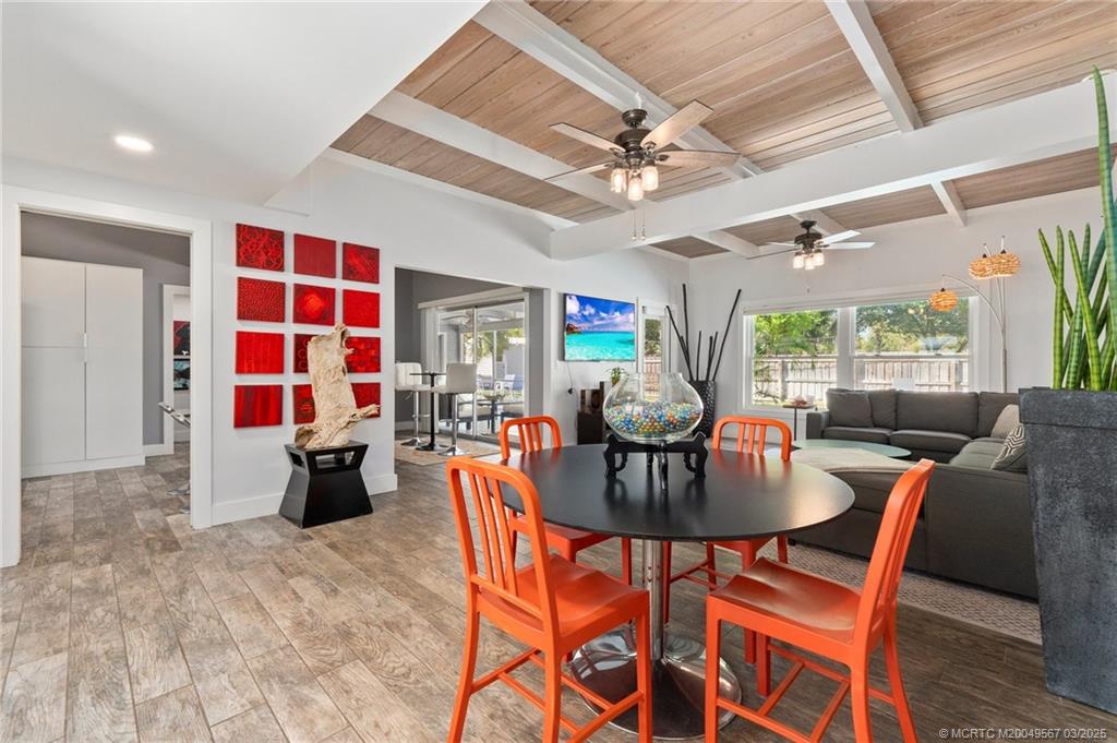 530 South Manor Drive Stuart, FL 34994 - Photo 10 of 55 a view of a dining room with furniture and a chandelier