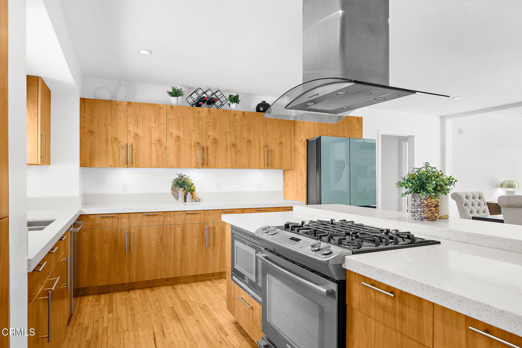 1881 Tulane Avenue Long Beach, CA 90815 - Photo 19 of 51 a kitchen with stainless steel appliances granite countertop a stove and a refrigerator