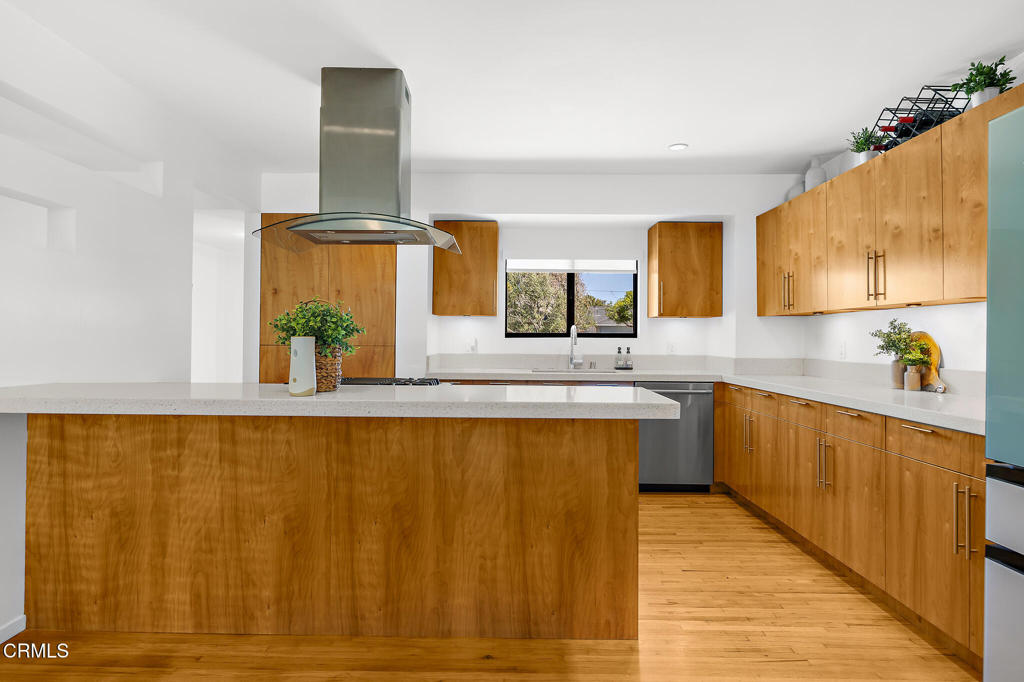1881 Tulane Avenue Long Beach, CA 90815 - Photo 20 of 51 a kitchen with stainless steel appliances a sink cabinets and wooden floor