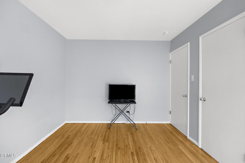 1881 Tulane Avenue Long Beach, CA 90815 - Photo 26 of 51 a view of room with wooden floor and flat screen tv