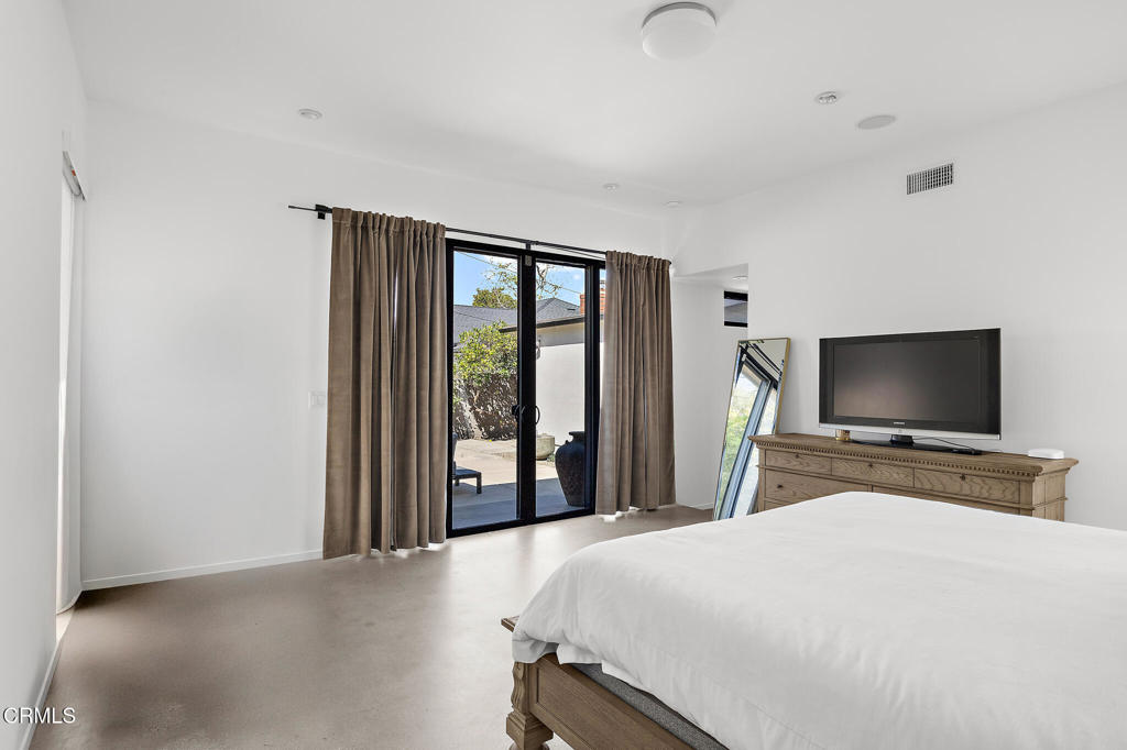 1881 Tulane Avenue Long Beach, CA 90815 - Photo 35 of 51 a bedroom with a bed and a flat screen tv