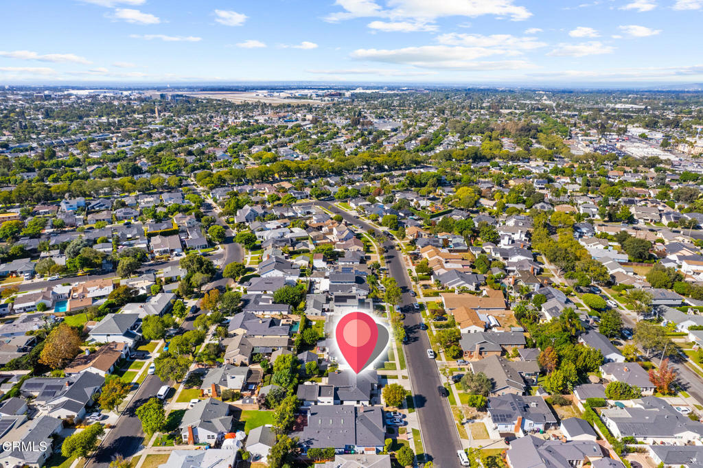 1881 Tulane Avenue Long Beach, CA 90815 - Photo 47 of 51 an aerial view of a residential apartment building with swimming pool and lawn chairs