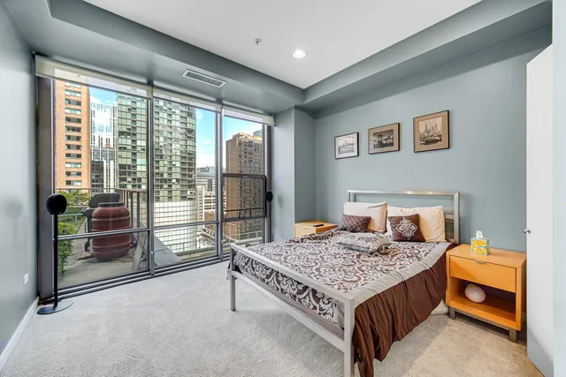 a bed room with a bed and a table