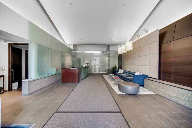 a view of a patio with table and chairs