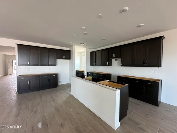 a kitchen with stainless steel appliances wooden cabinets and a sink