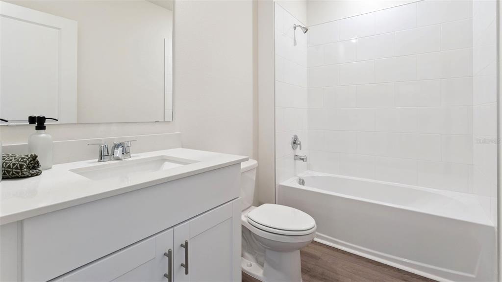 5276 Masser Road St. Cloud, FL 34772 - Photo 14 of 20 a bathroom with a sink a toilet and shower